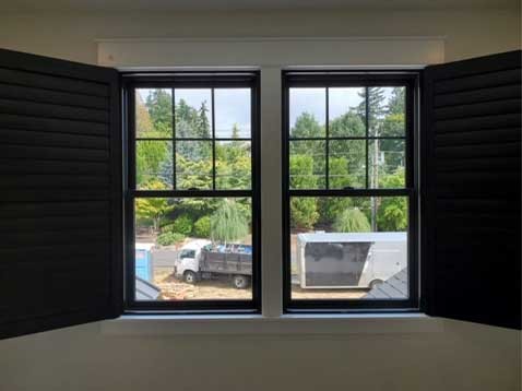 Double window with shutters